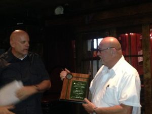Wallace accepts award for the Pic-A-Lilli from Pat Boylan