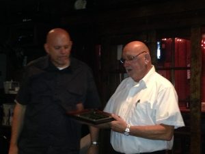 Wallace admiring award, which included ABATE Lifetime Membership
